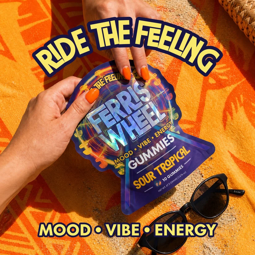 Ferris Wheel Sour Tropical gummies pouch on a beach towel: ride the feeling, mood, vibe, energy